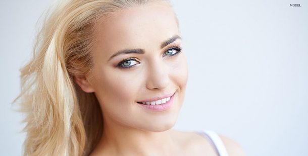 Blond Smiling Model with Light Pink Lips