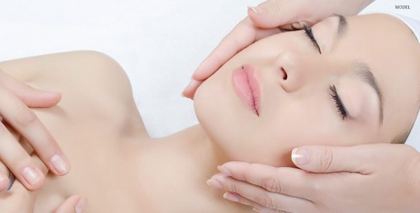 Hands Cupping Female Model's Face