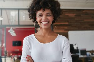 Happy Black Woman With Smooth Skin, Bright Smile & Sculpted Neck